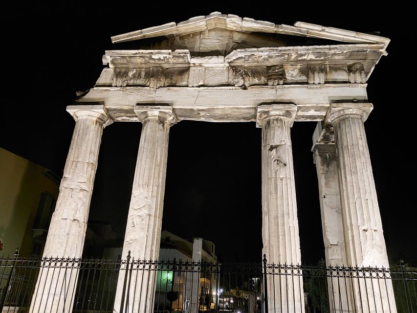 Athens: City Highlights Nighttime Walking Tour in Spanish - Starting beneath the National Library sculpture