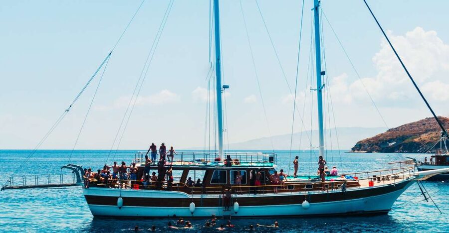 Athens: Full-Day Island Hopping Cruise with Lunch & Transfer - Agistri: pine trees, clear water, and small villages