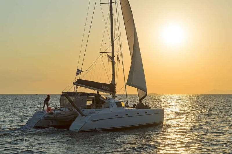 Athens: Half-Day Sunset Catamaran Cruise with Meal & Drinks - Sailing away from Athens on a modern catamaran