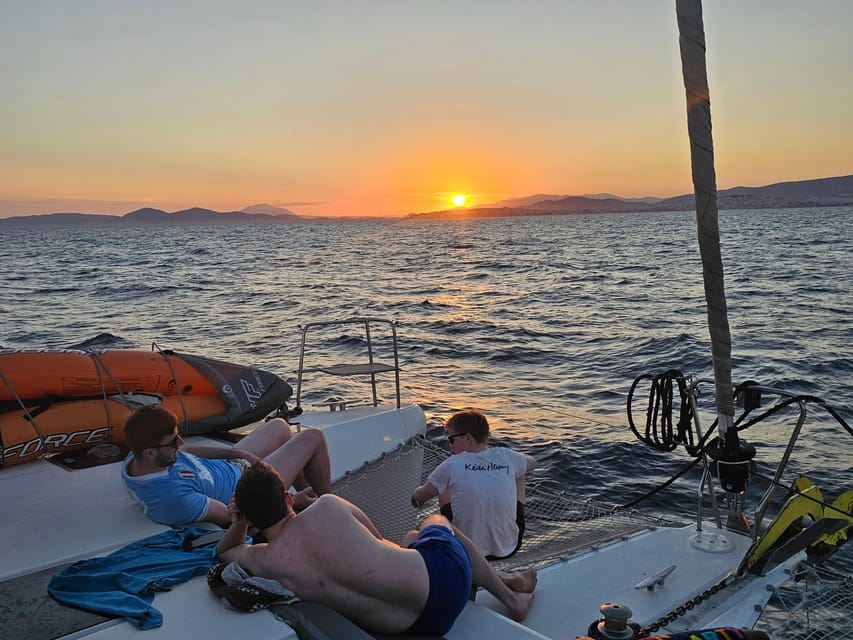 Athens: Riviera Catamaran Tour with Fresh Meal and Drinks - What makes the crew important