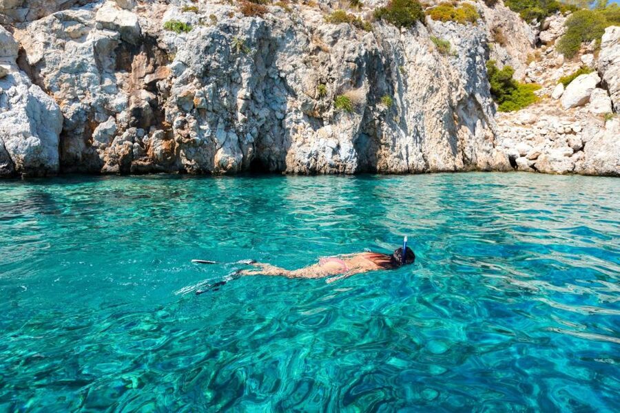 Athens: Swimming Cruise with Lunch, Wine & Live DJ on Board - The sunset return becomes a floating party