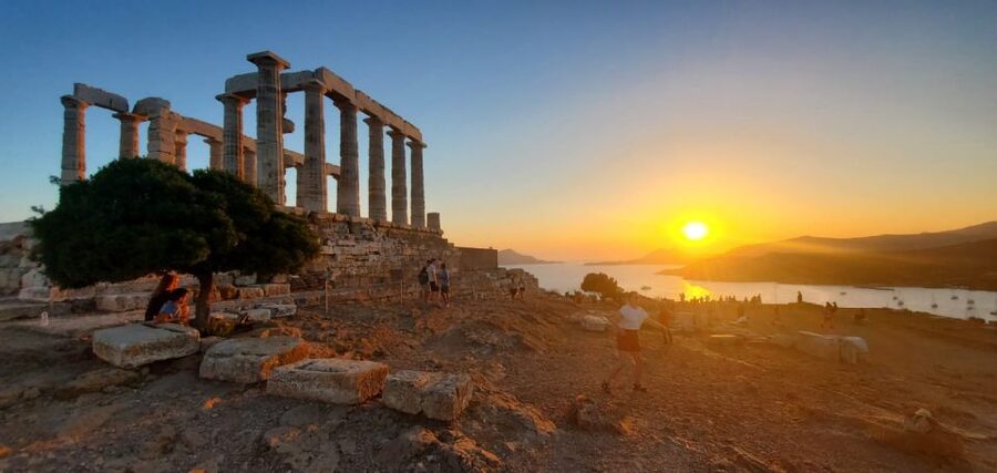 Athens: Temple of Poseidon and Cape Sounion Sunset Tour - Sunset at Sounion, with the sea below