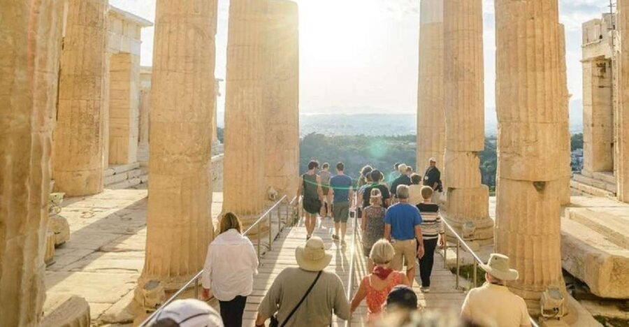 Athens: The Acropolis Walking Group Tour with a French Guide - The uphill walk to the ancient citadel