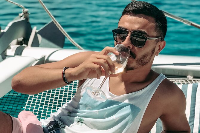 Chania: Afternoon Catamaran trip - Dinner, Drinks & Sunset - The Agioi Theodoroi bay stop