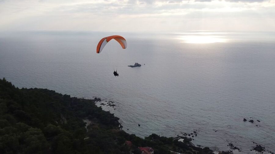 Corfu: Paragliding Tandem Flight Above Pelekas Town - Meeting near Giannades, then preparing to fly