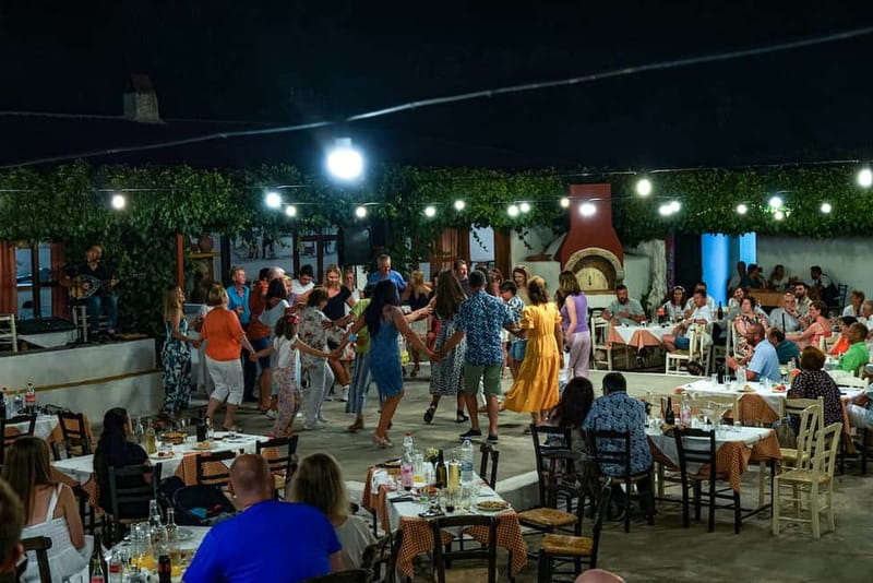 Cretan Night: Dinner & Live Show at Pano Karouzanos Village - Dinner with Cretan food and local wine