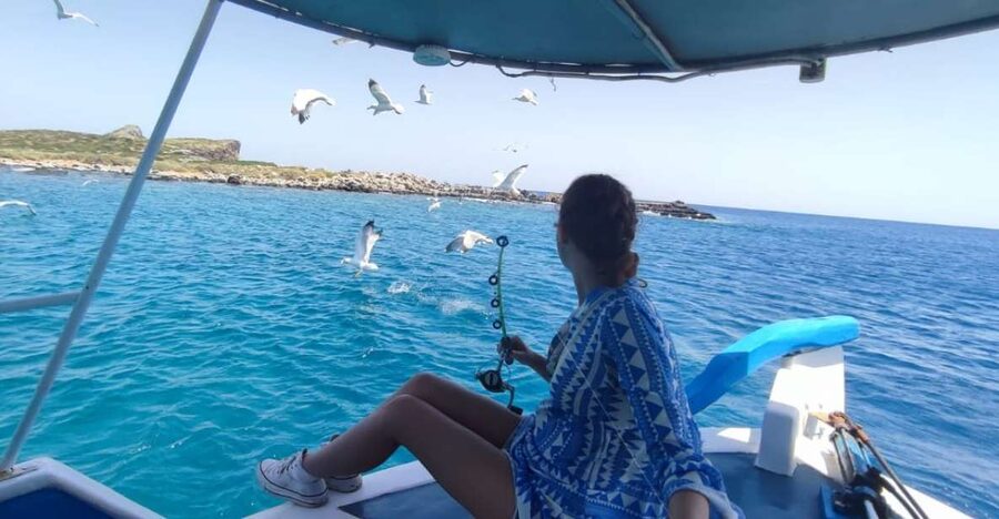 Crete: Fishing & Swimming Boat Cruise with Lunch & Drinks - Swimming and snorkeling while lunch cooks