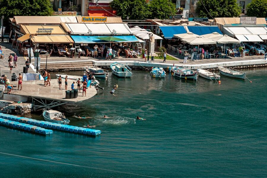 Elounda: Spinalonga Guided Boat Tour with BBQ and Swimming - The boat ride across Mirabello Bay