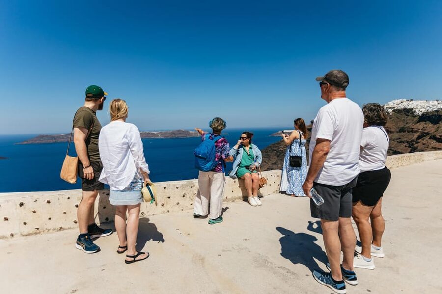Fira: Guided Foodie Walking Tour with Tastings - Pace, weather, and physical demands