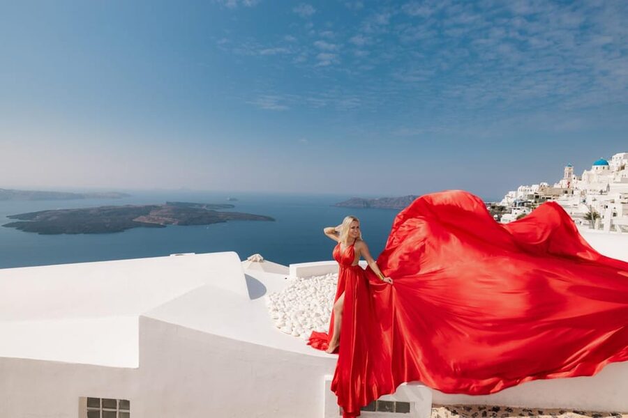 Flying dress Photoshoot in Santorini with Hotel Pickup - Imerovigli, blue domes, and Caldera views