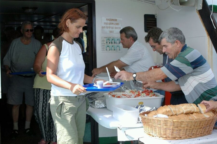 From Ag. Nikolaos: Spinalonga & Kolokytha Cruise with Lunch - Exploring Spinalonga with a map and booklet