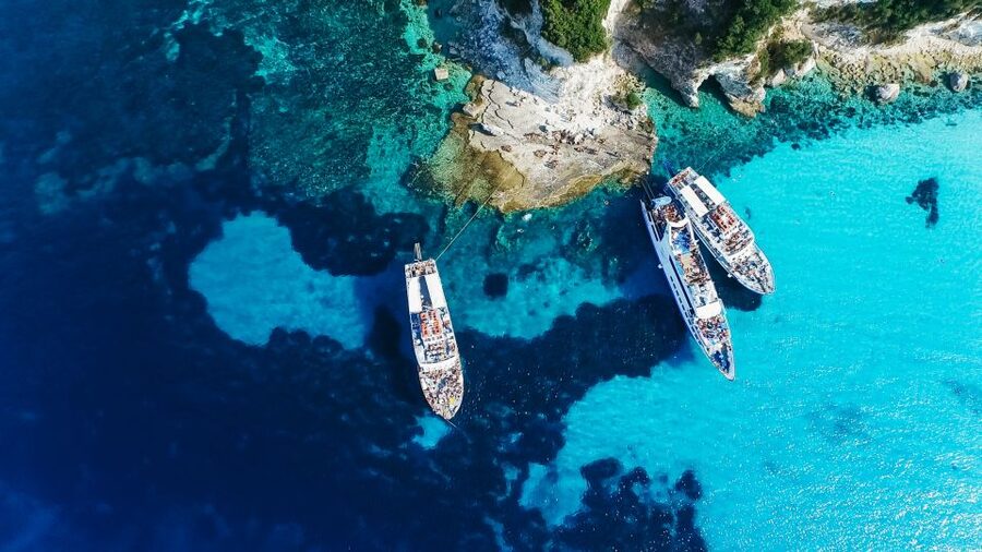 From Corfu: Day Cruise to Paxos, Antipaxos, and Blue Caves - Leaving Corfu with old-town views