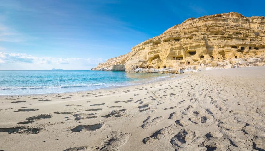 From Heraklion: Day Trip to Matala Hippie Beach and Caves - Guide languages and what the day feels like
