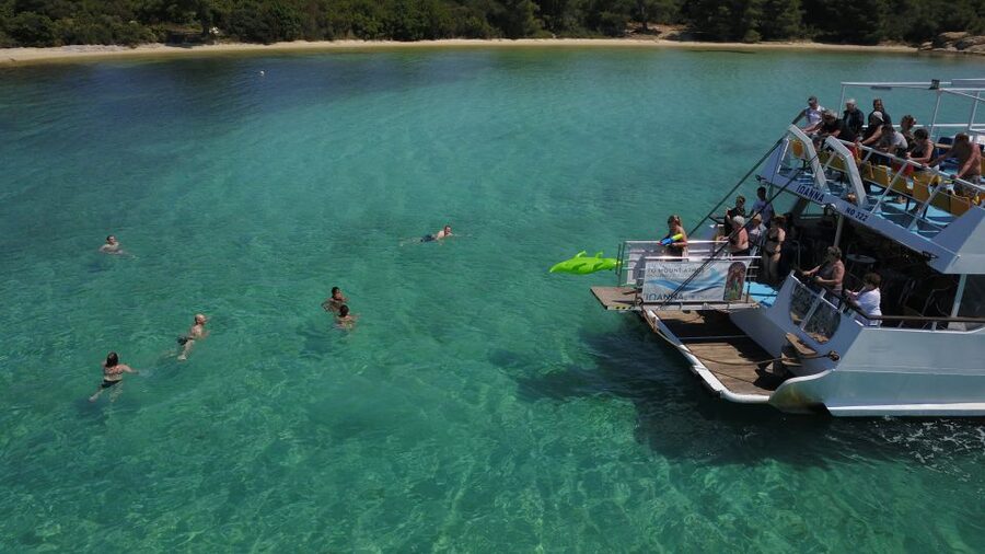 From Ouranoupoli: Blue Lagoon Two Island Cruise - Banana Beach is the relaxed center of the day