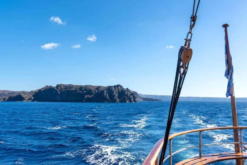 From Santorini: Volcano Cruise With Oia Sunset - Hiking the active volcano at Nea Kameni