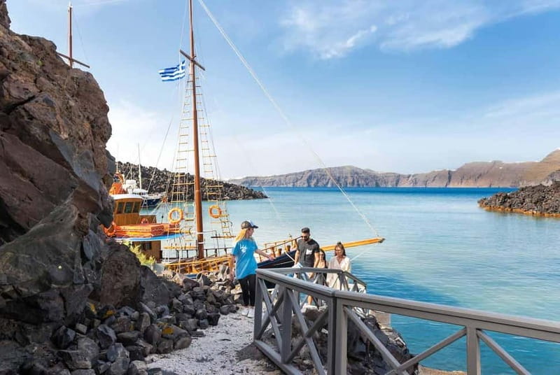From Santorini: Volcano Cruise With Oia Sunset - Swimming in the sulfur waters at Palea Kameni