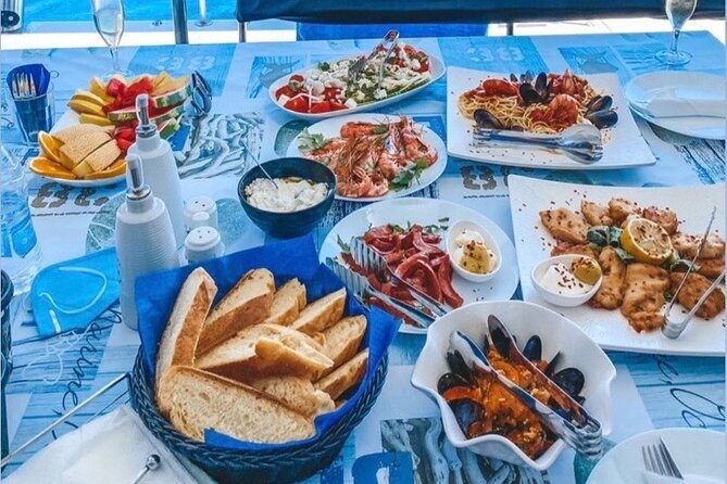 Half-Day Exclusive Catamaran Cruise in Santorini with Meal and Open Bar - The return route past Fira and Black Mountain