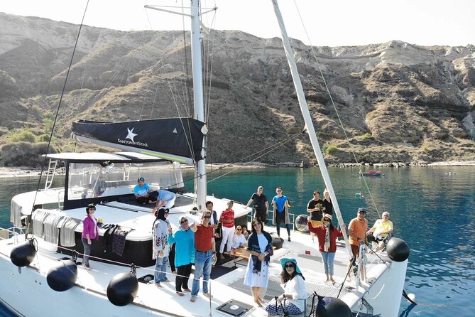 Half-Day Exclusive Catamaran Cruise in Santorini with Meal and Open Bar - The Venetian Lighthouse and the volcanic coast