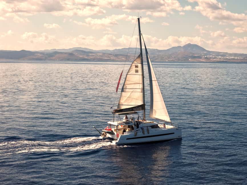 Hersonissos: Sunset Catamaran Cruise with Snacks and Drinks - Meeting the boat at Hersonissos Port
