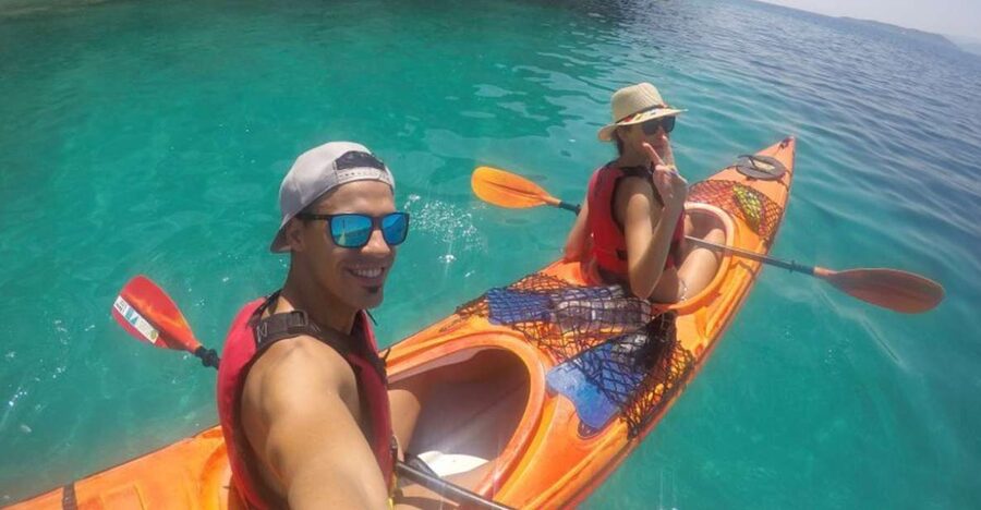 Lefkada: Hidden Blue Cave Kayak Trip with Lunch & Fruits - Entering the Blue Cave through its secret opening