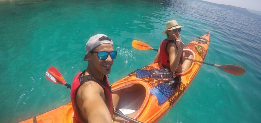 Lefkada: Hidden Blue Cave Kayak Trip with Lunch & Fruits - Snorkeling above the red starfish seabed