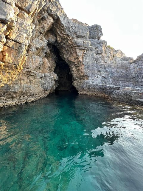 Lindos,Pefkos: All inclusive Swim & Snorkel Boat Cruise - Navarone Bay and its steep coastal cliffs