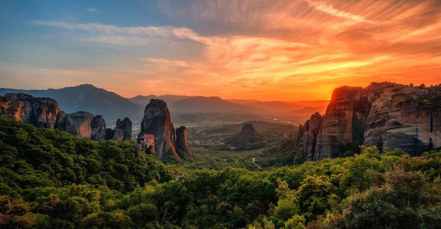 Meteora: Guided Sunset Tour with Monasteries & Caves Visit - Holy Trinity and the other monasteries from the road
