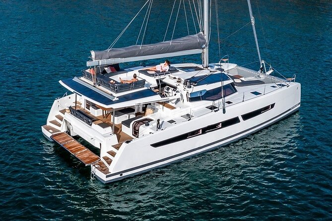 Mykonos: Brand-New Catamaran Cruise with Meal, Drinks & Transport - Rhenia and the southern coast