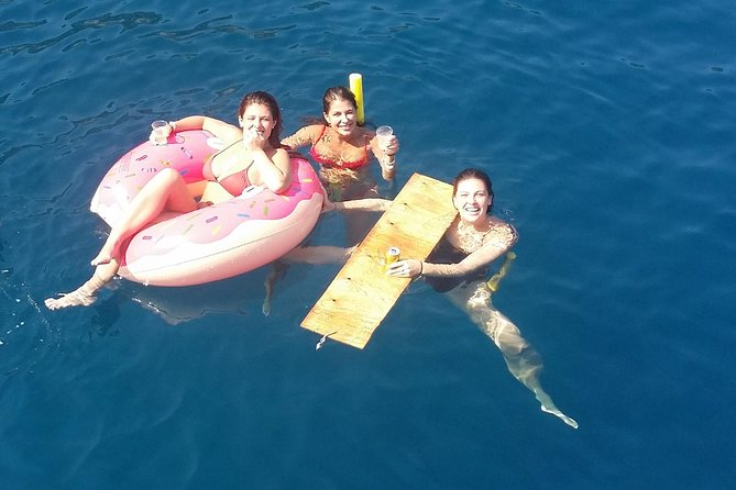 Rhodes Exclusive Swim Cruise Cocktail Open bar & Gourmet Buffet - Leaving Mandraki Harbour with Rhodes at your back
