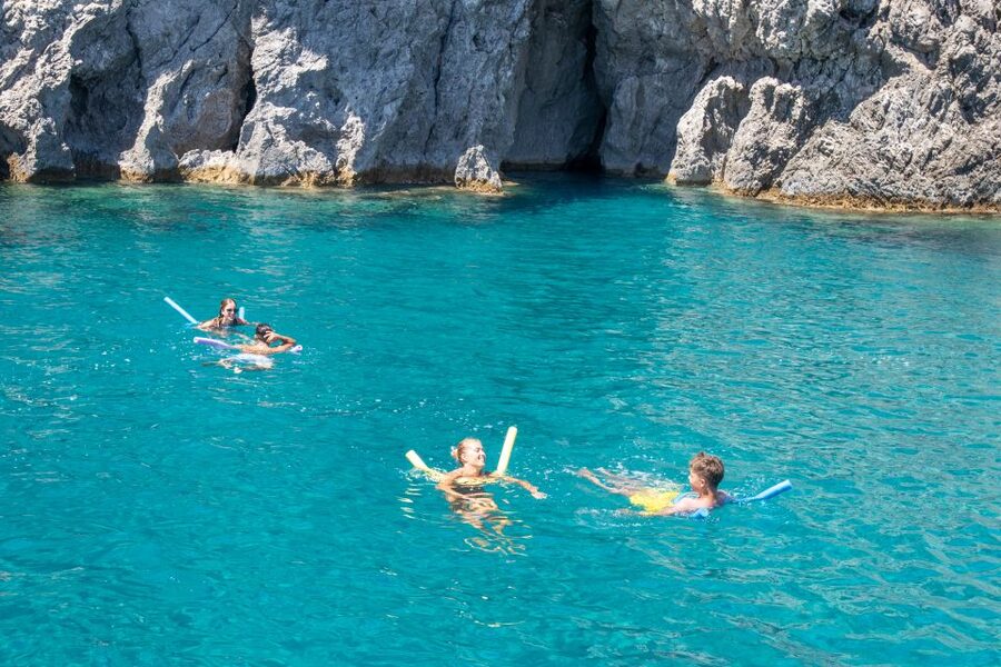 Rhodes: Full Day East Coast Bay to Bay Boat Trip with Lunch - Afandou Caves: a rocky stop from the water