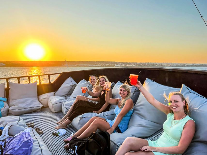Rhodes: Sunset Cruise with Greek BBQ and Unlimited Drinks - The sunset near Rhodes Town