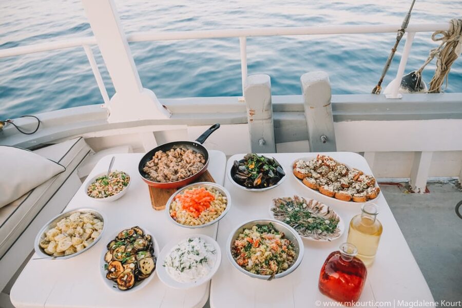 Rhodes: Sunset Cruise with Live Music, Wine & Greek Buffet - Sunset, live music, and the return to Rhodes