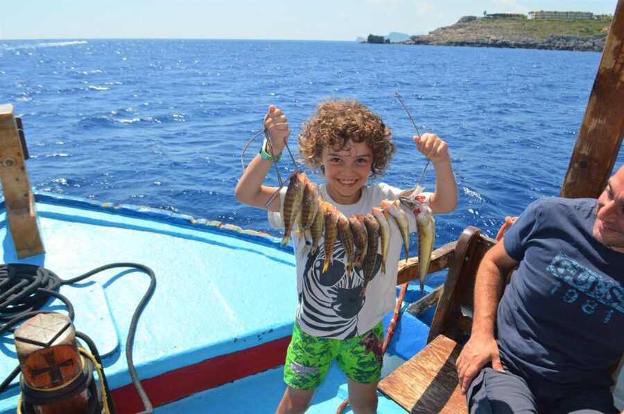 Rhodes Town: Fishing Boat Trip with Fish Meal and Swim Stops - A fishing boat, not a sightseeing ship