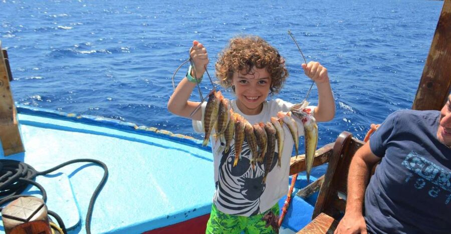 Rhodes Town: Fishing Boat Trip with Fish Meal and Swim Stops - The first view of Rhodes from Mandraki Harbor