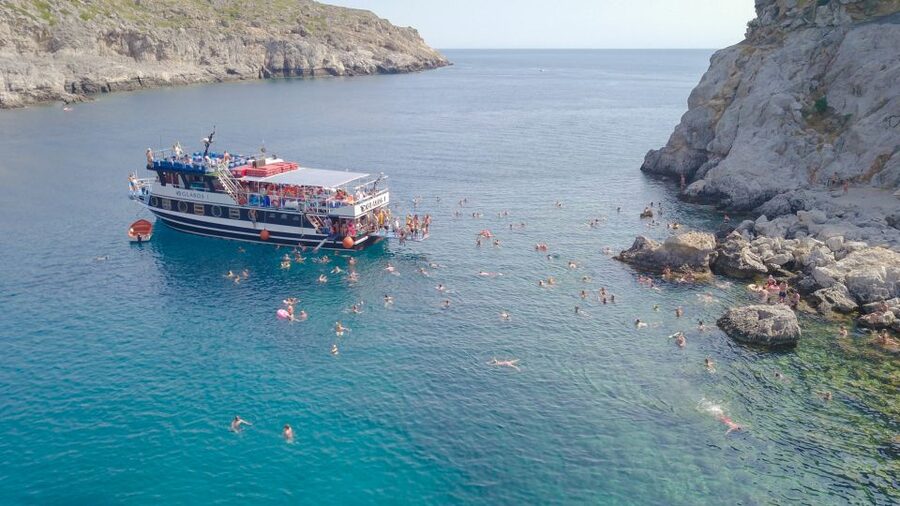 Rhodes Town: Scenic Cruise to Lindos with Swim Stops - Sailing out from Mandraki Port
