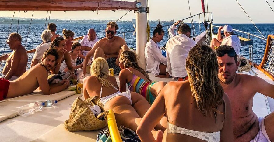 Rhodes Town: Sunset Boat Cruise with Drinks & Snacks - Sailing out from Mandraki Marina