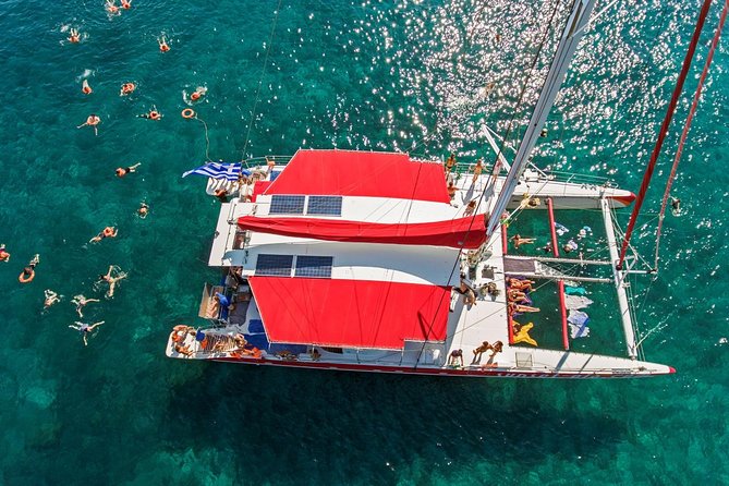 Sailing Catamaran Cruise in Santorini with BBQ, Drinks and Transfer - Seeing Santorini from the catamaran