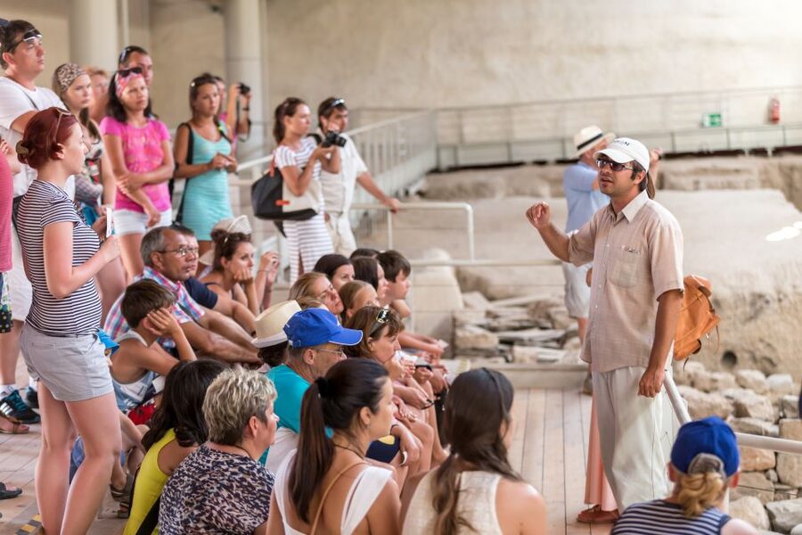 Santorini: Akrotiri Prehistoric City Guided Walking Tour - Walking through streets preserved under pumice