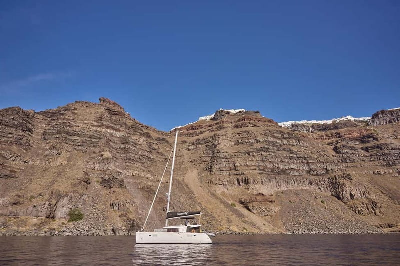 Santorini: Caldera Classic Catamaran Cruise w/ Meal & Drinks - White Beach and the southern coast