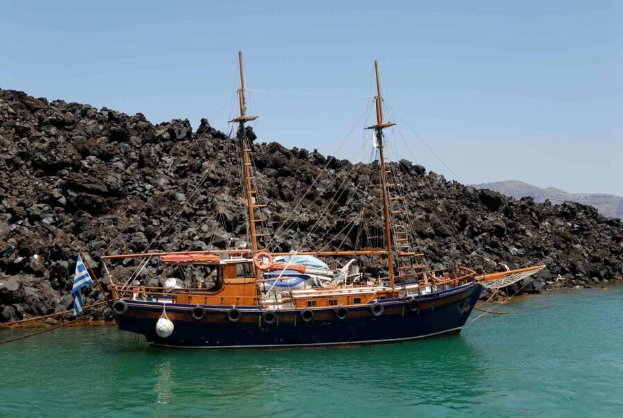 Santorini Caldera: Sunset Cruise with Dinner - Sailing under Oia before the sunset