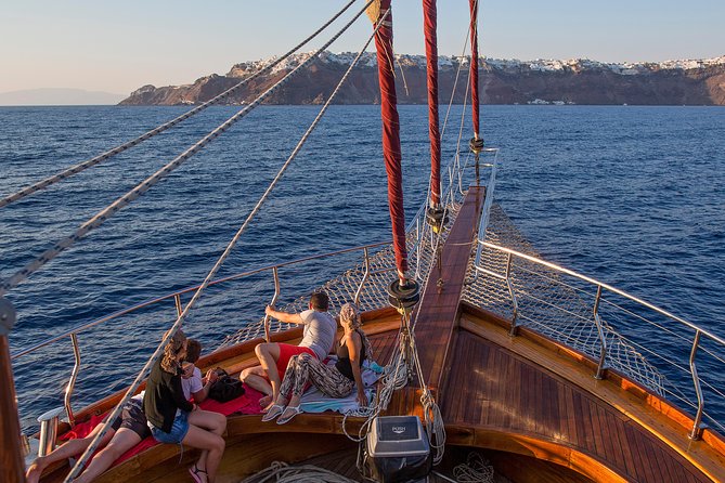 Santorini Caldera Sunset Sailing Cruise with Dinner and Wine - Sunset near Oia from the caldera