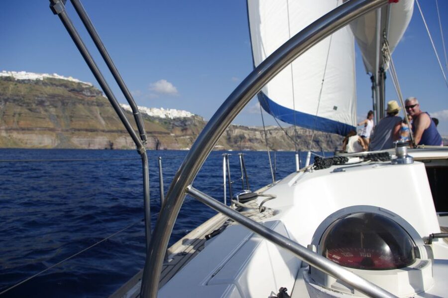 Santorini Caldera: Sunset Sailing Cruise with Meal - Why the water is the best place to watch Santorini change