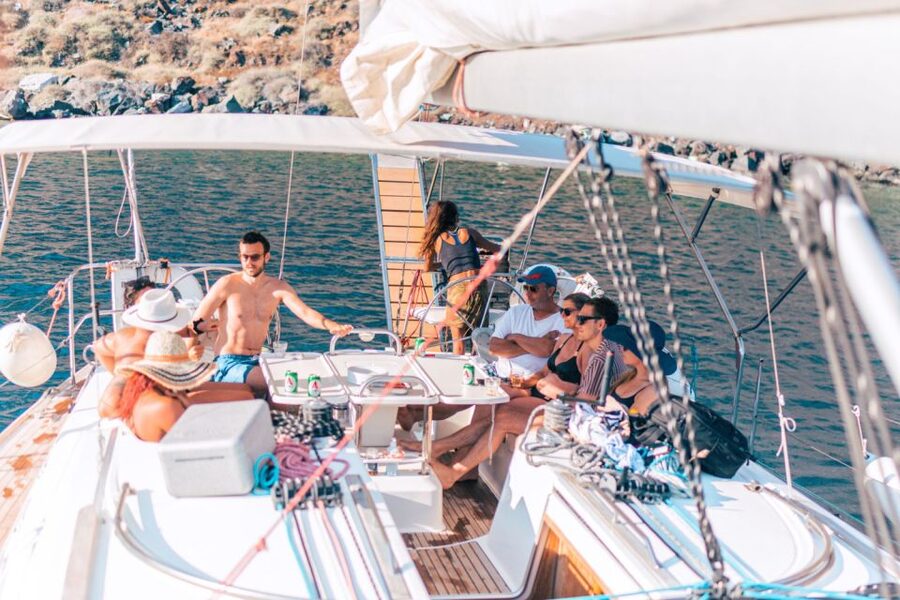 Santorini Caldera: Sunset Sailing Cruise with Meal - Sailing past Indian Rock and the Akrotiri lighthouse