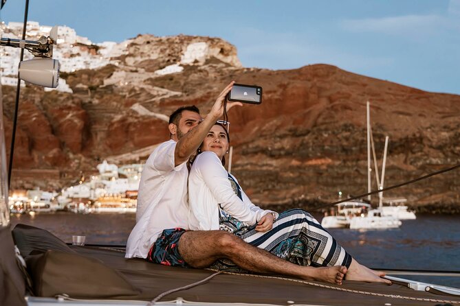 Santorini Catamaran Cruise with Greek Meal, Open-Bar and Sunset - Red Beach, White Beach, and the south coast