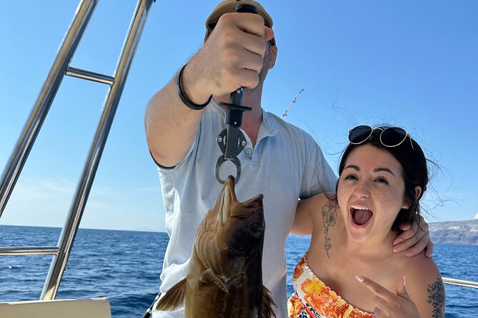 Santorini Fishing Private Cruise boat tour - BBQ, Snorkeling - Seeing Santorini from below the cliffs