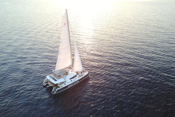 Santorini Luxury Catamaran Sunset Cruise with BBQ, Drink and Transfer - Setting off from Ammoudi or Athinios