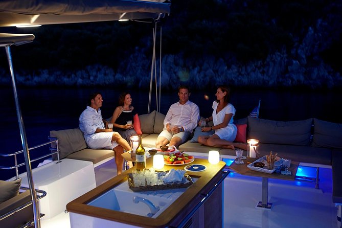Santorini Luxury Catamaran Sunset Cruise with BBQ, Drink and Transfer - White Beach, lunch, and the longest stop