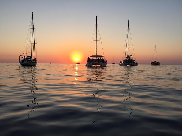 Santorini Luxury Catamaran Sunset Cruise with BBQ, Drink and Transfer - The sunset is the payoff