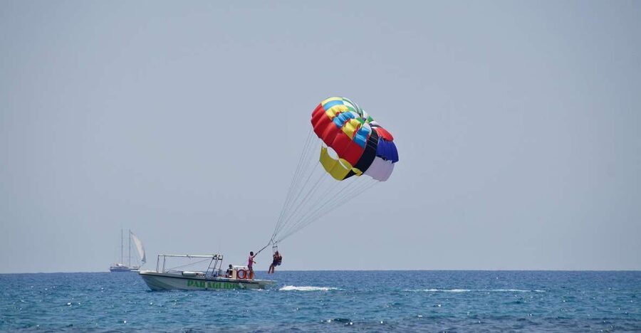 Santorini: Parasailing Flight Experience at Black Beach - Returning to Perivolos and checking the photos