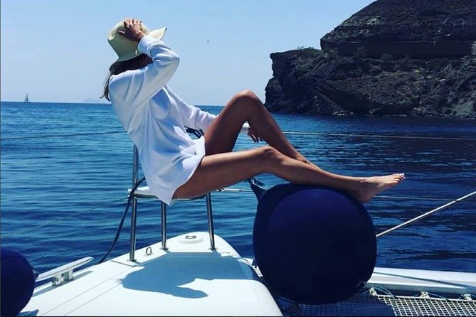 Santorini Platinum Catamaran Cruise with Meal, BBQ and Open Bar - The Akrotiri lighthouse and the volcanic hot springs